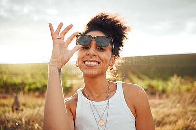 Buy stock photo Young black woman, sunset portrait in field countryside and happy smile with summer sunglasses in Brazil. Outdoor adventure in nature, travel freedom on vacation and holiday 
trip alone in sunshine