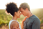 Love, travel and couple in mexico, hug and share intimate moment in countryside, bond at sunset. Freedom, nature and interracial man and woman embrace, talk and enjoy relationship in florida field