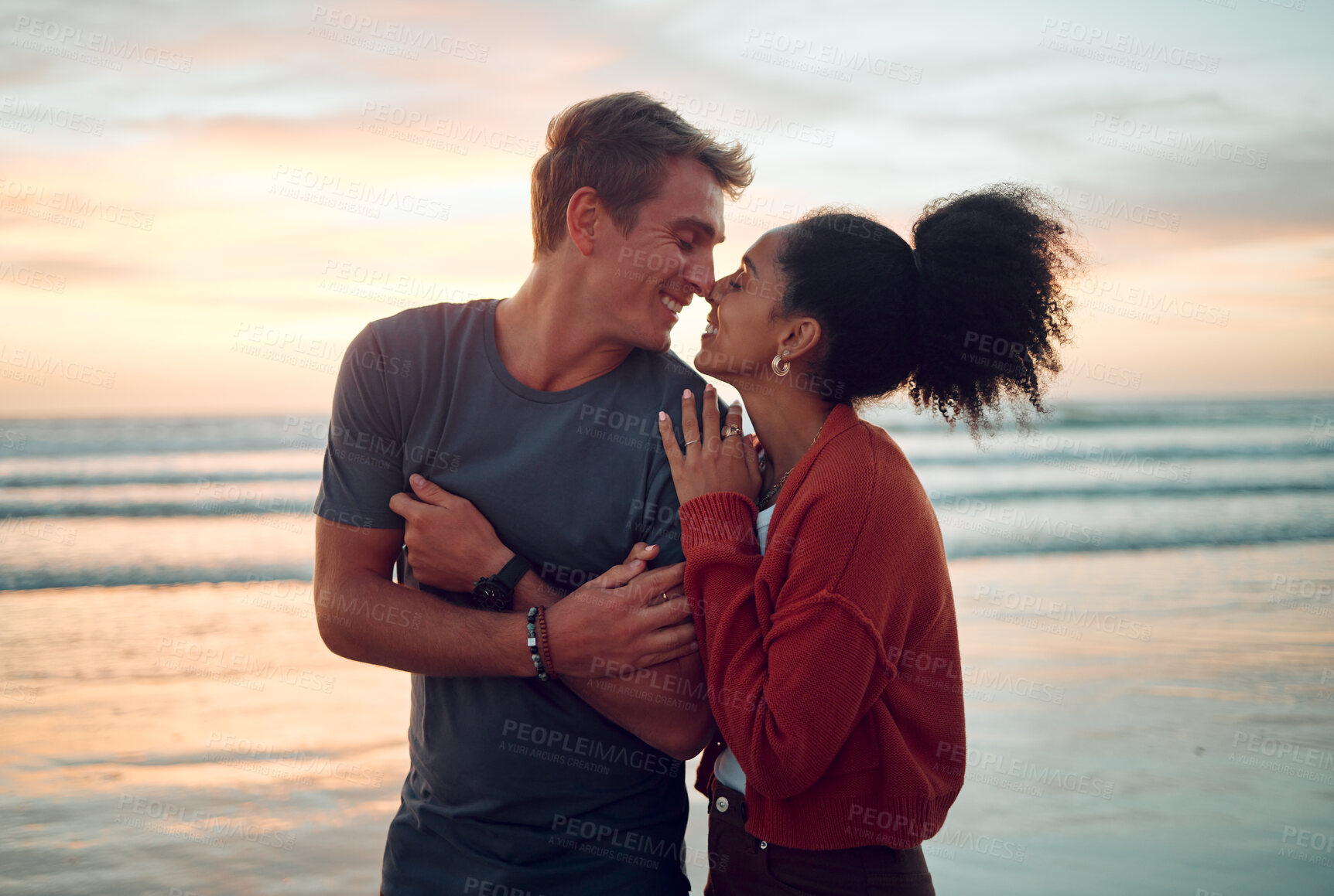 Buy stock photo Love, beach and couple kiss at sunset, happy and bonding on their summer vacation in Florida. Travel, freedom and romance with man and woman enjoying a walk along the ocean and showing affection