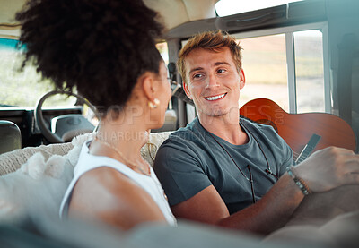 Buy stock photo Camper, van and couple relax while travel, happy, talking and bonding in their vehicle together. Love, freedom and content woman and man enjoying their journey and vacation exploring and having fun