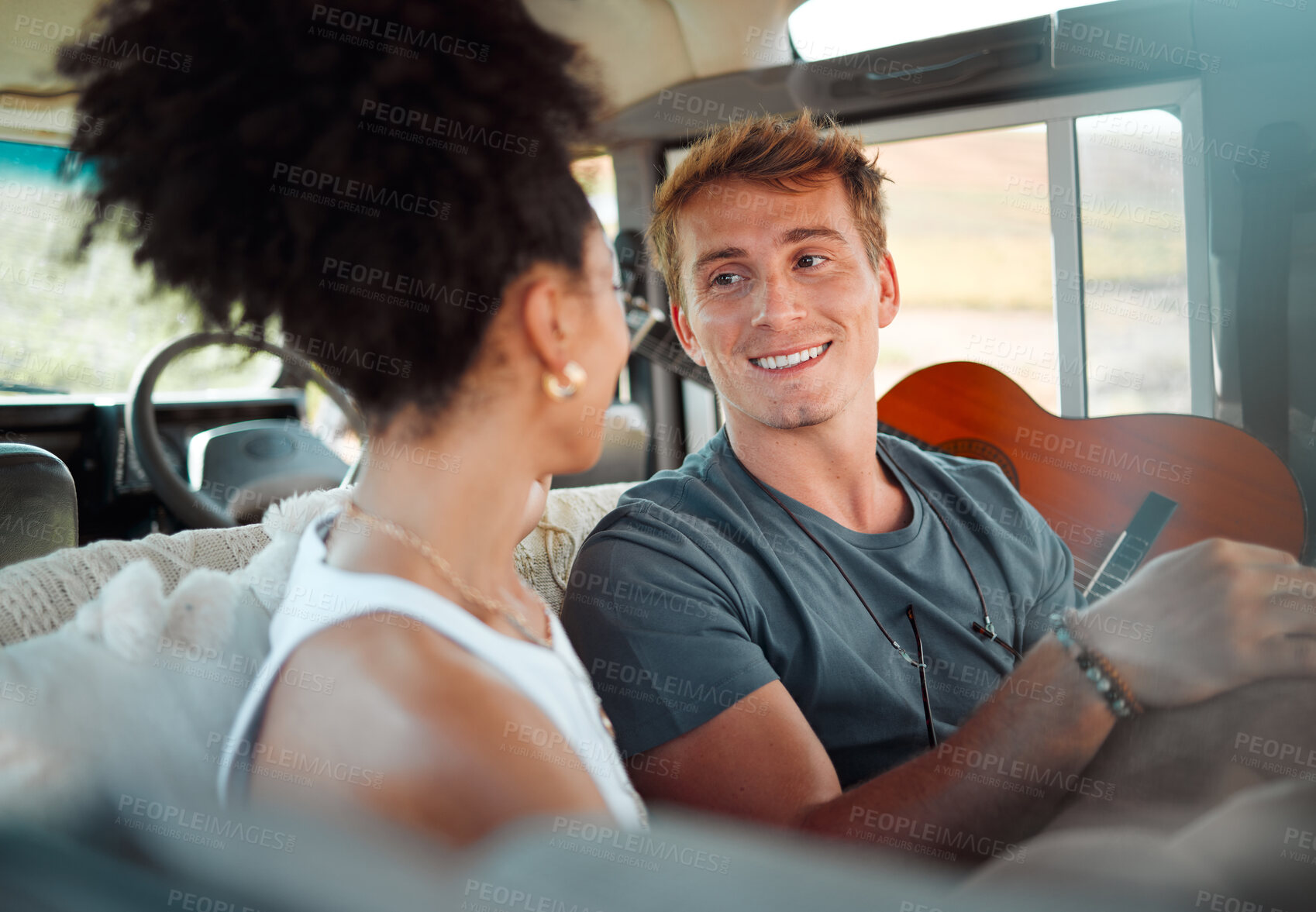 Buy stock photo Camper, van and couple relax while travel, happy, talking and bonding in their vehicle together. Love, freedom and content woman and man enjoying their journey and vacation exploring and having fun