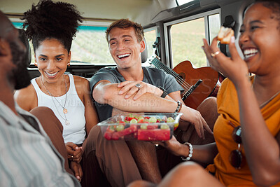 Buy stock photo Travel, road trip and friends in car with food while they laugh and relax on summer vacation. Interracial friendship with happy holiday people on picnic break together with fruit in vehicle.

