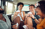 Friends, car road trip and game of card for diversity group of people having fun, bond and enjoy quality vacation time together. Transport, smile and happy gen z students travel for holiday freedom