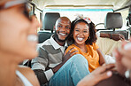 couple, travel and happy on vacation road trip with friends, excited, laughing and bonding together in camper. Funny relax, married black man and woman comic jokes while traveling in car
