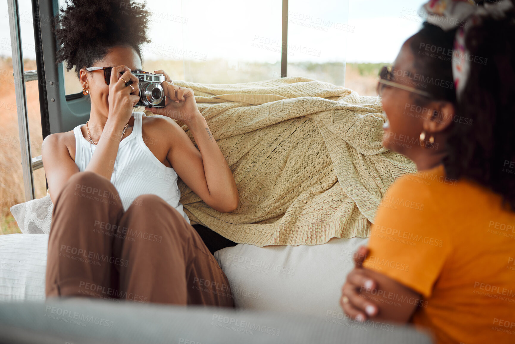 Buy stock photo Girl friends, road trip and with camera in van for vacation pose in vehicle on holiday together have fun, bonding and smile. Photograph, women and being happy relax, enjoy travel and weekend getaway.