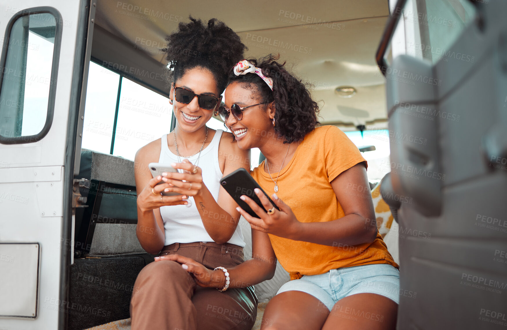 Buy stock photo Black friends, phone and social media travel in communication together for road trip adventure. Happy and excited African American women sharing moments of traveling on mobile smartphone for vacation