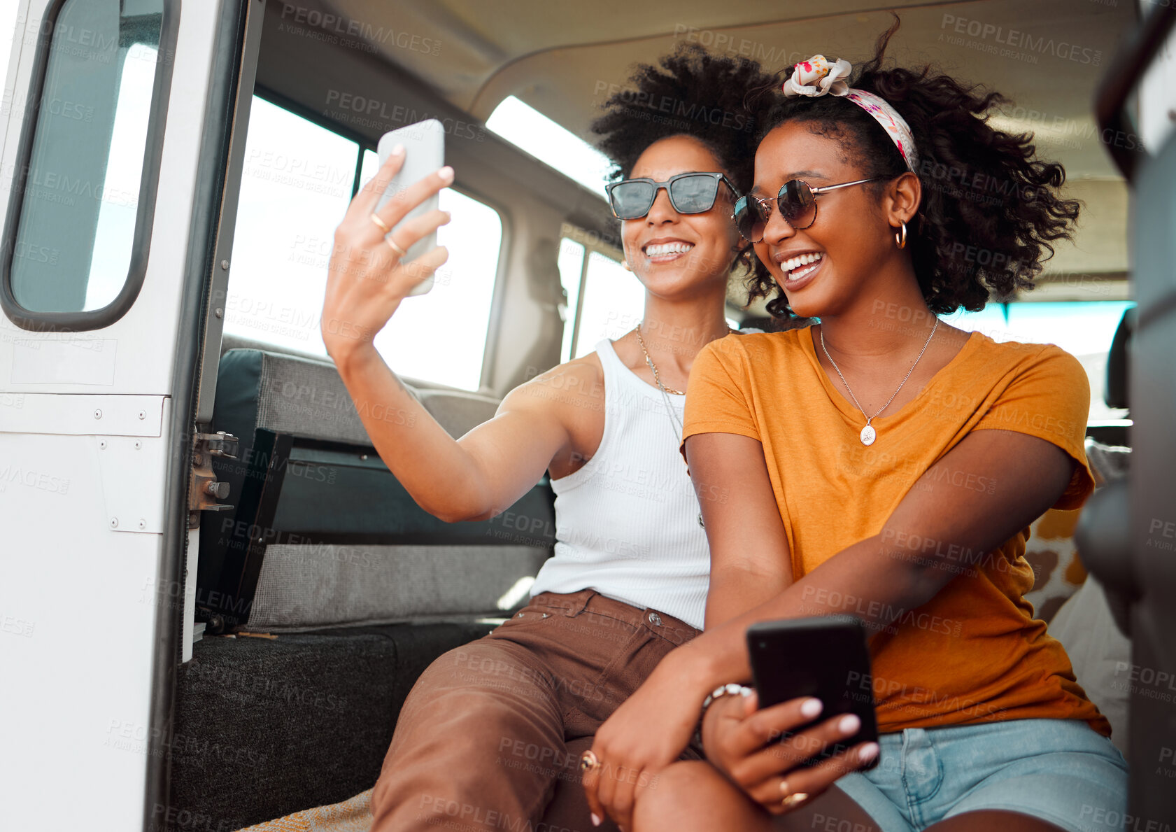 Buy stock photo Selfie, road trip and friends live streaming on social media with phone during travel holiday in a van in Jamaica. African women with photo on mobile on vacation in car for camping in summer together