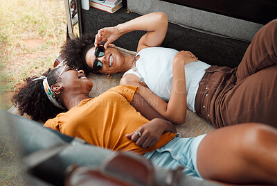 Buy stock photo Women, camper and happy lying down on road trip, travel or vacation together in summer, holiday or break. Black woman, friends and smile at funny, crazy or comic time while relax in transport to rest