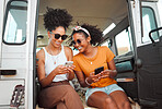 Women, road trip or phone for social media, gps location or map app for safari game drive or summer travel. Smile, happy or bonding friends with 5g mobile technology in camper van in nature landscape