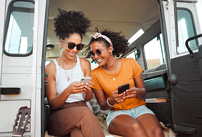 Buy stock photo Women, road trip or phone for social media, gps location or map app for safari game drive or summer travel. Smile, happy or bonding friends with 5g mobile technology in camper van in nature landscape