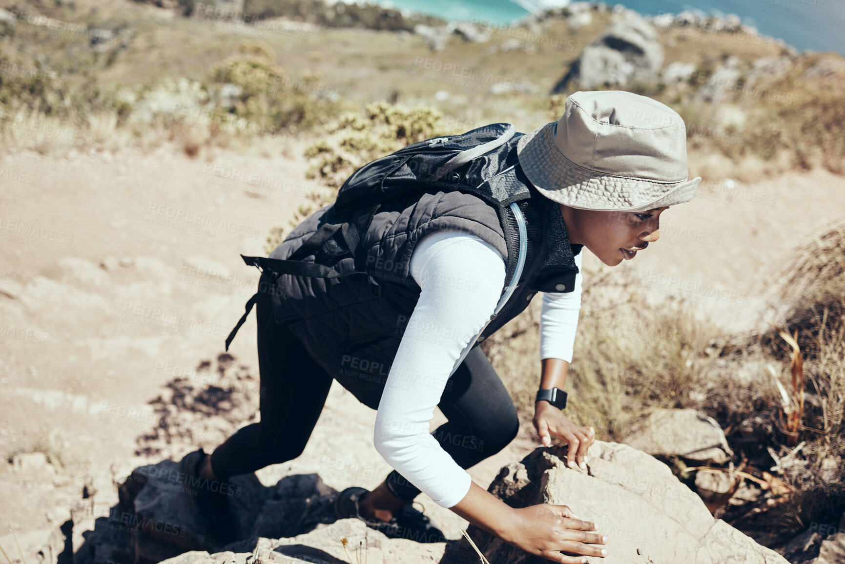 Buy stock photo Woman, hiking and rock on mountain for climbing, workout or fitness. Girl, health and exercise for training, sport and wellness on adventure in nature in summer on hill, hiker and stone in Australia