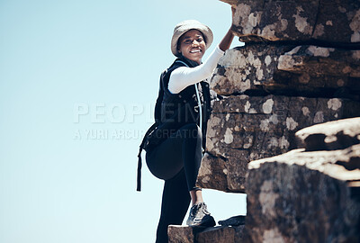 Buy stock photo Black woman, climbing a rock mountain and adventure in nature for healthy exercise or sport workout. African American female in sports fitness with smile for summer rocky climb in South Africa