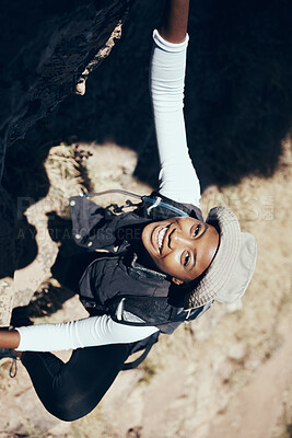 Buy stock photo Hiking, black woman or rock climbing on mountain for workout or fitness. Girl, health and exercise for training, sport or wellness on adventure in nature in summer on hill, hiker or stone in Canada