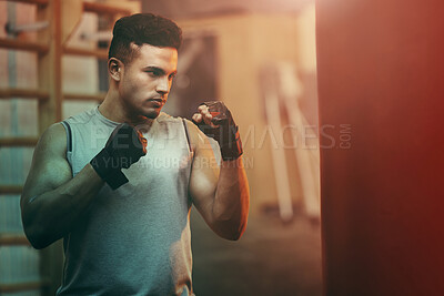 Buy stock photo Boxer, workout or training man with punching bag working on sports fitness, exercise and strength. Athlete, fighter or martial arts in a boxing, health and wellness gym or fight club studio 