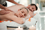 Love, relax and couple at a spa for a massage to celebrate marriage, anniversary or birthday on holiday. Man and woman sleeping with luxury care and wellness therapy for body on vacation at a hotel