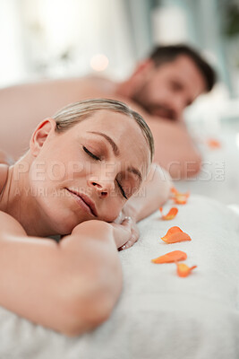 Buy stock photo Relax, spa and couple in luxury massage for health, wellness and therapy treatment at a resort indoors. Man and woman resting head on massaging table to enjoy a calm day of zen, care and relaxation