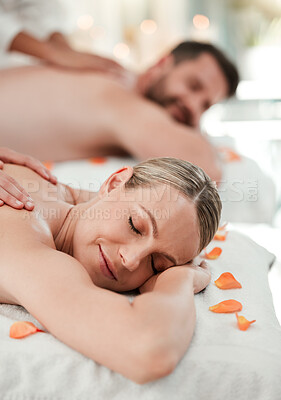Wellness, beauty and couple massage at spa for health and relax in zen resort, peaceful and happy. Salon, luxury and man and woman enjoy treatment by massage therapist on their vacation in Thailand