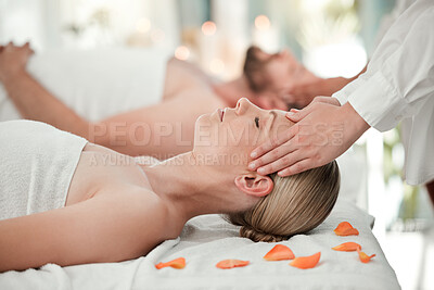 Woman, spa and massage on head while on bed with flowers for relax, wellness and calm on vacation. Luxury, health and physical therapy for couple at hotel, salon and hands on scalp for natural care