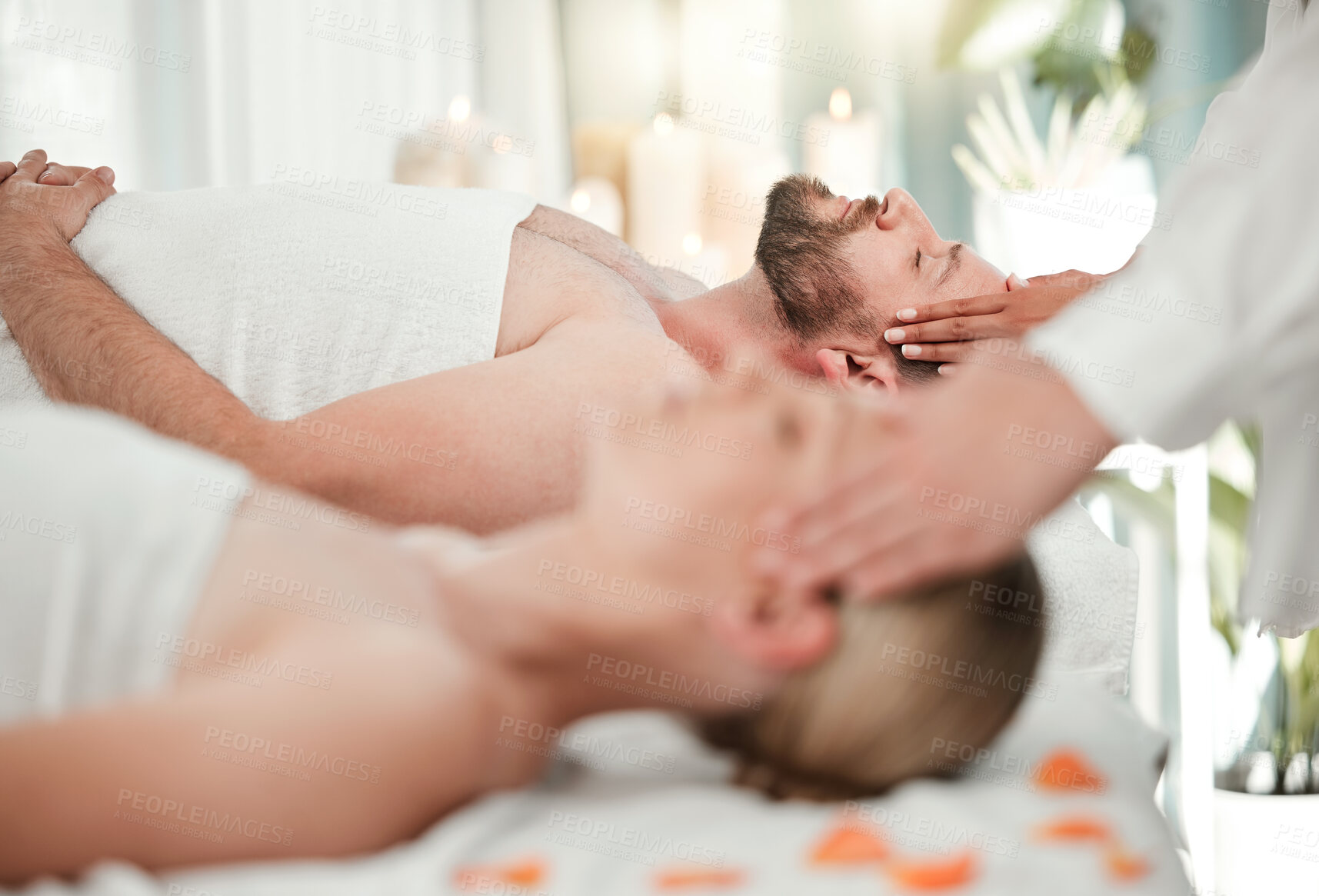 Buy stock photo Relax, spa and couple head massage on table bed in luxury hotel, hospitality or salon scalp messaging. Reiki, wellness or acupressure therapy for headache or stress relief of man and woman together.
