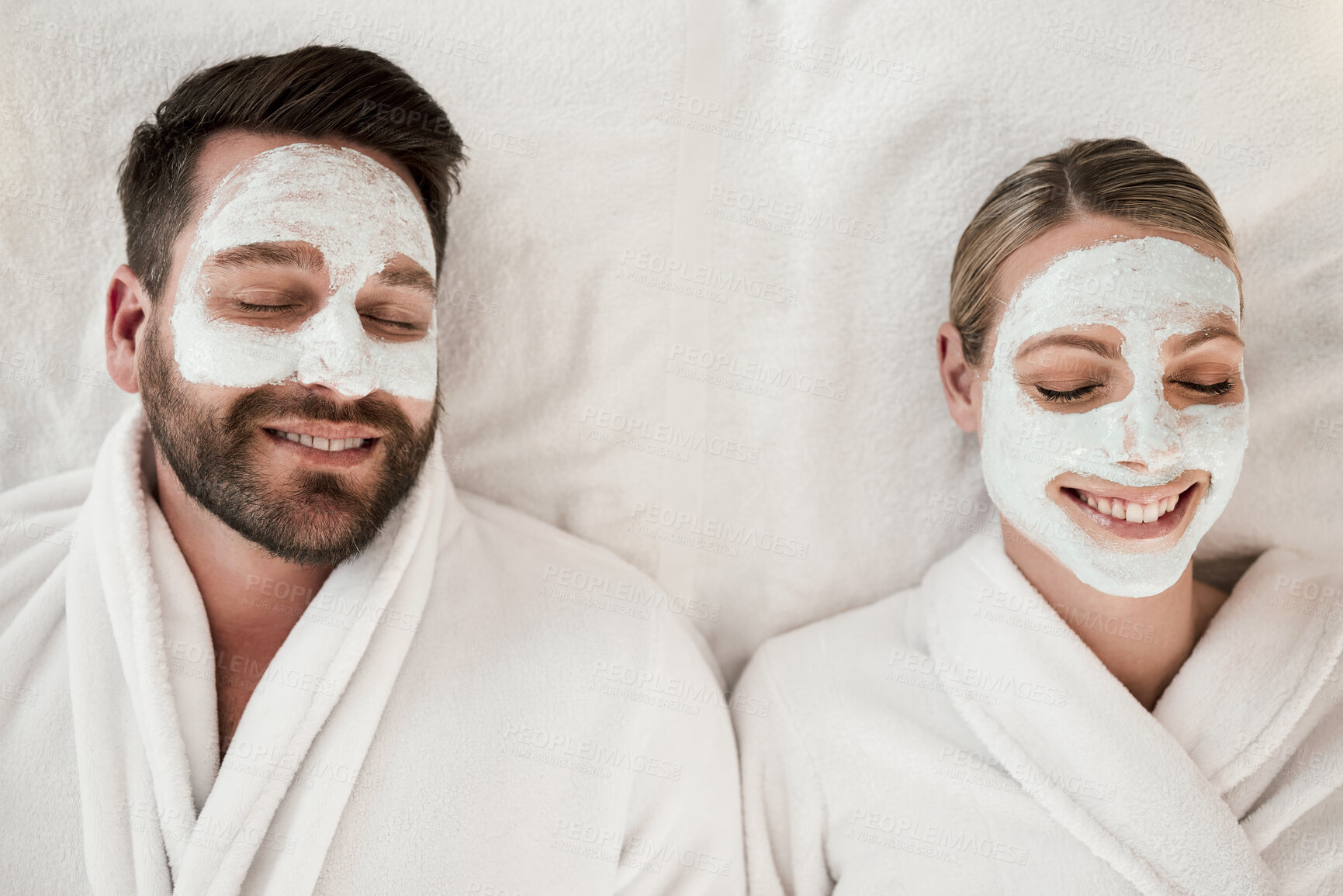 Buy stock photo Skincare, spa and face mask with relax couple smile, happy and luxury cosmetic treatment together from above. Man and woman skincare, beauty and wellness at a health clinic for relaxation body care