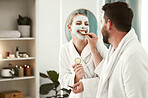 Happy couple, facial and relax at spa for wellness, skincare, love together and eating cucumber. Healthy relationship, luxury body care and physical therapy for calm and zen at health salon. 