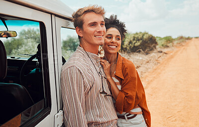 Buy stock photo Happy couple, travel and smile for road trip in the countryside on vacation together in nature. Interracial man and woman smile for relationship traveling, adventure and holiday bonding in the desert
