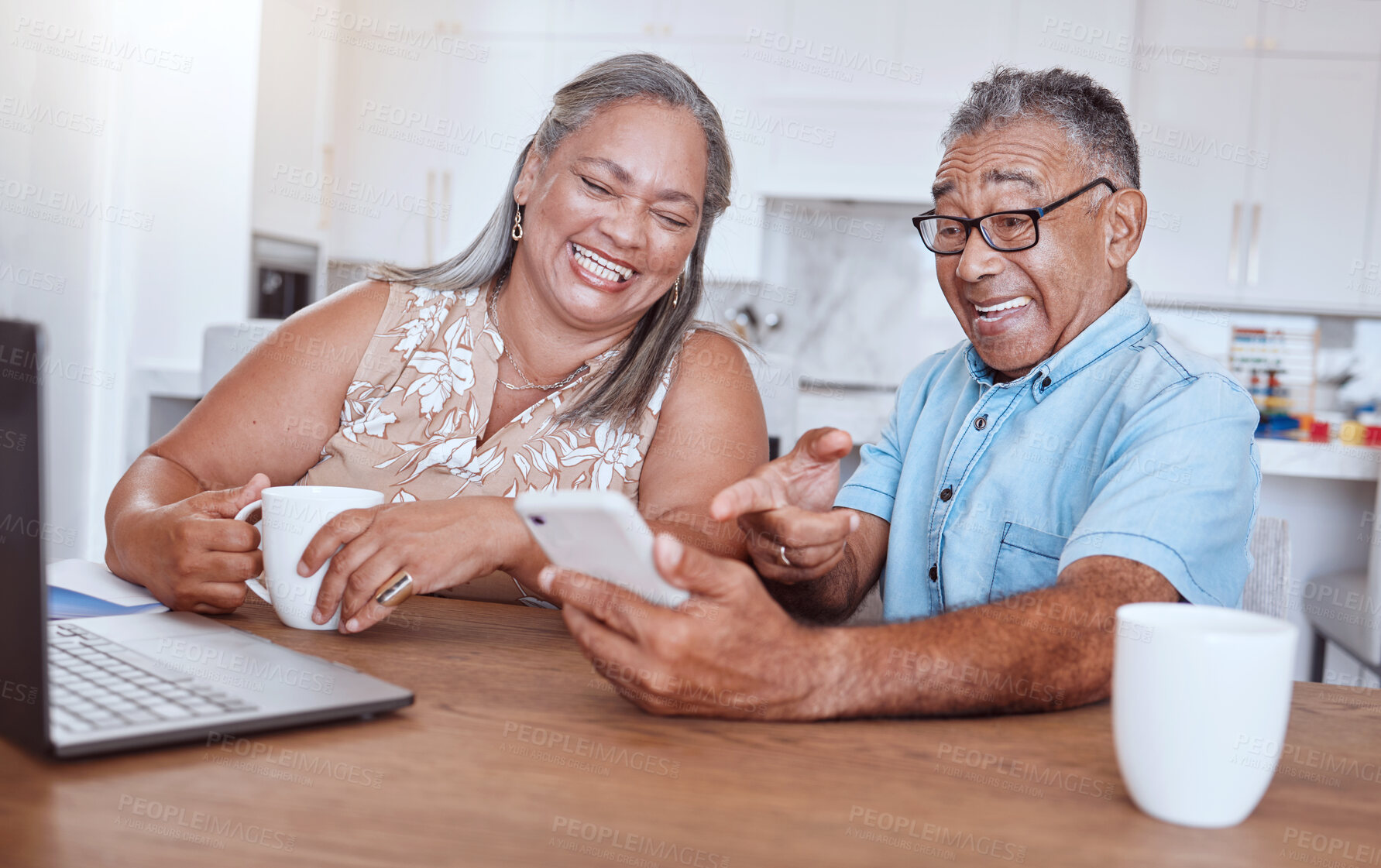 Buy stock photo Phone, video call and happy elderly couple talking and laughing while drinking coffee and bonding at a table. Happy family, love and retired man and woman enjoy online communication and subscription