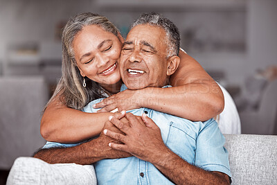 Buy stock photo Happy senior couple, hug and relax in love for relationship bonding together in tender happiness at home. Joyful elderly man and woman smile in hope embracing romance for retirement house on sofa