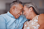 Love, laugh and happy elderly couple relax and bond in a living room, laughing and sharing a funny joke in their home together. Family, humour and senior man and woman embrace and enjoy retirement