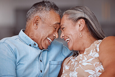 Buy stock photo Love, laugh and happy elderly couple relax and bond in a living room, laughing and sharing a funny joke in their home together. Family, humour and senior man and woman embrace and enjoy retirement