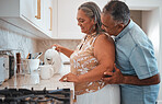 Love, hug and senior couple smile in kitchen with coffee, talking and bonding together. Happy family, relax and retirement by elderly man and woman enjoy conversation, speaking and pension lifestyle