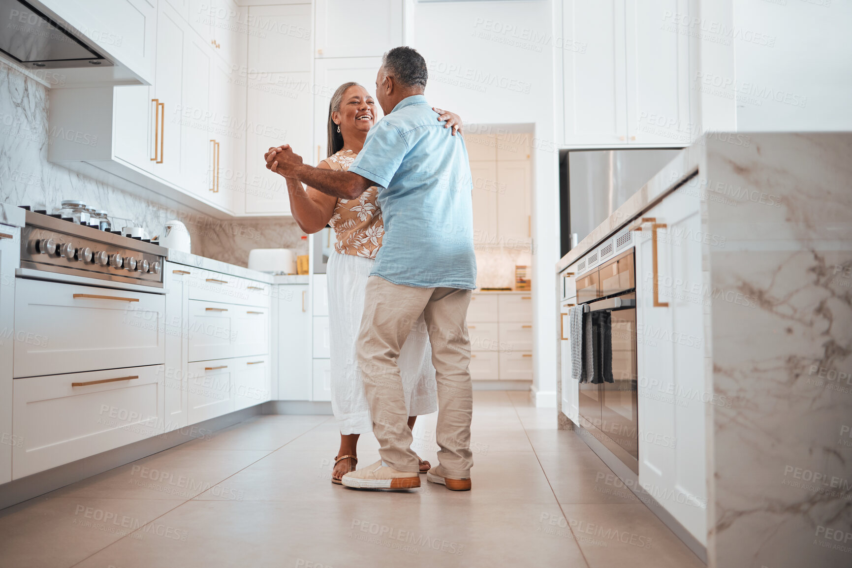 Buy stock photo Couple, elderly and dance in kitchen for love, romance and happy together while home in retirement. Senior, man and woman do fun dancing in house for bonding, happiness and care with smile on face