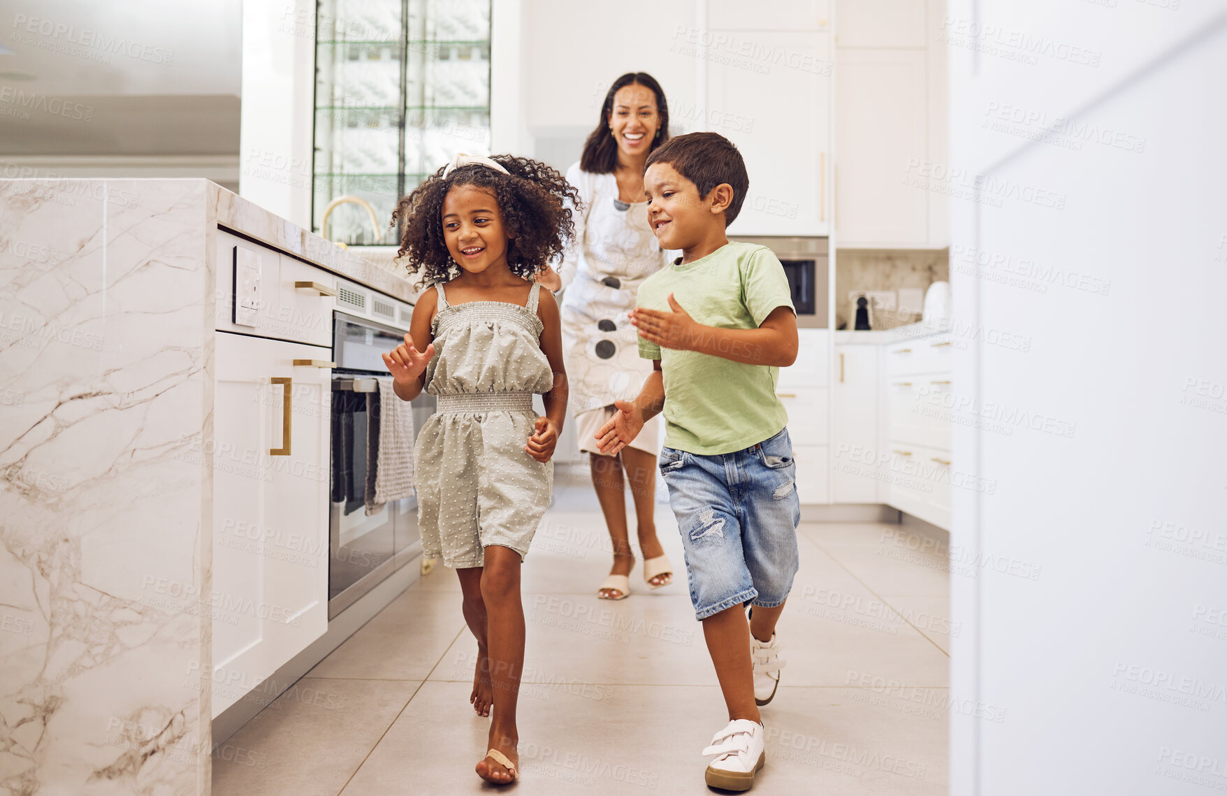 Buy stock photo Mother, kids play together running game and family bonding in kitchen at home. Smiling playful mother, happy excited energetic children and actively enjoying fun leisure indoor activity with mom