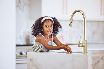 Buy stock photo Clean, smile and African child washing hands with water by the tap in the kitchen in a house. Happy portrait of a girl kid cleaning her hand with liquid for health and safety from virus in her home