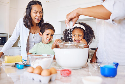 Buy stock photo Cooking, children and food with a family baking or learning in the kitchen of their home together. Kids, happy and teaching with a mother and father showing a son and daughter how to bake in a house