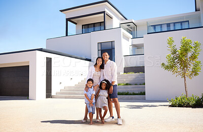 Buy stock photo Portrait, real estate and happy family moving into their new luxury home, house or property in summer. Happy parents and children standing with a smile outdoor with building investment or purchase
