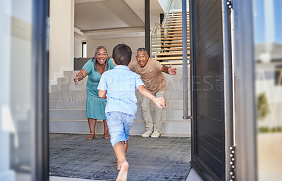 Buy stock photo Excited kid running to grandparents in family home meeting, greeting and hugging with love, care and happiness. Elderly man, senior woman and happy people welcome grandson child at front door house