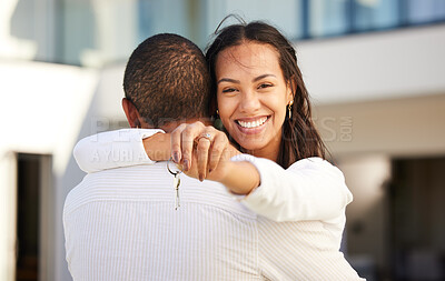 Buy stock photo Happy couple moving with keys of house, property and real estate with a hug and smile after purchase, rent or buy new home or apartment. Man and woman or homeowners relocate together with joy 