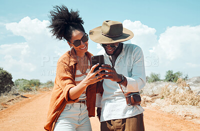 Buy stock photo Black couple with phone, travel and adventure, happy outdoors in outback Australia during summer vacation. Romantic, bonding roadtrip and smile, search for map on mobile app or internet.