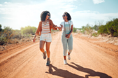 Buy stock photo Love, lesbian and couple holding hands on road path in Arizona wilderness for holiday together. Happy, dating and young gay women enjoy romantic walk in USA desert for summer travel vacation.