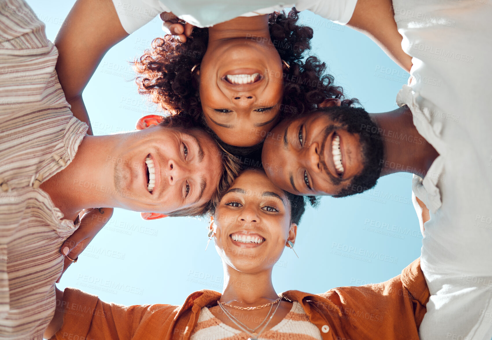 Buy stock photo Friends, happy heads together and diversity in circle with smile from below. Friendship, happiness and support, university students group hug. Smiling, hugging and looking down, men and women huddle.