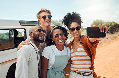 Buy stock photo Friends, holiday and selfie on adventure safari road trip together in African game reserve. Diversity, travel and happy group of men and women smile for picture on phone in nature on road in Africa.