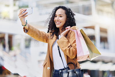 Buy stock photo Fashion, shopping and woman taking a selfie in the city standing in the street. Black woman with shopping bags, phone in hand and taking a picture in retail shopping mall, happy from sale or discount