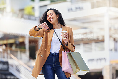 Buy stock photo Time, shopping and woman with notification on watch with coffee in the city of Los Angeles. Happy, smile and girl walking with smart technology for fashion deal and retail bag in the mall after sale