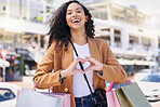 Heart, hands, shopping and woman with smile for retail, fashion and designer sale in the city of Miami. Portrait of a young girl in the street for a market, bags and love for store in the road