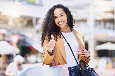 Buy stock photo Thumbs up, shopping and retail with a woman customer on the search for a sale, bargain or deal in an outdoor mall. Thank you, winner and hand with a young female in a store to shop, buy or purchase