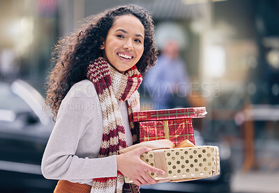 Buy stock photo Woman, smile and gifts shopping for christmas, birthday or party while walking in street. Girl, happy and present in boxes for holiday, celebration or family at festive event walk road in Cape Town