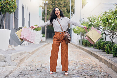 Buy stock photo Woman customer, in street and with shopping bags celebrate sale from store, shopping and happy with purchase. Female consumer, confident client and excited outdoor, discount items and retail therapy.