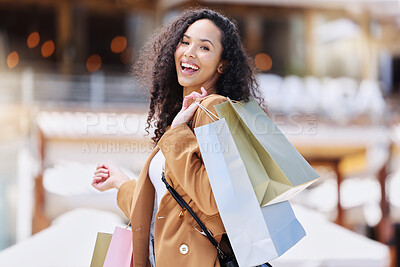 Buy stock photo Shopping, happy and portrait of customer with bag after shopping spree buying retail fashion product on store discount. Sales, smile and young black woman at luxury shopping mall to purchase clothes