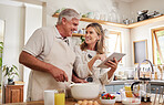 Cooking, tablet and senior couple with video for breakfast food on the internet in the kitchen of their house. Elderly man and woman talking about digital recipe on technology for lunch in their home